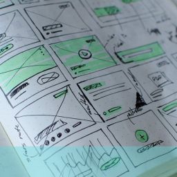 photo of a book containing various wireframe designs