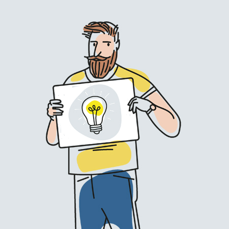 man holding board with lightbulb